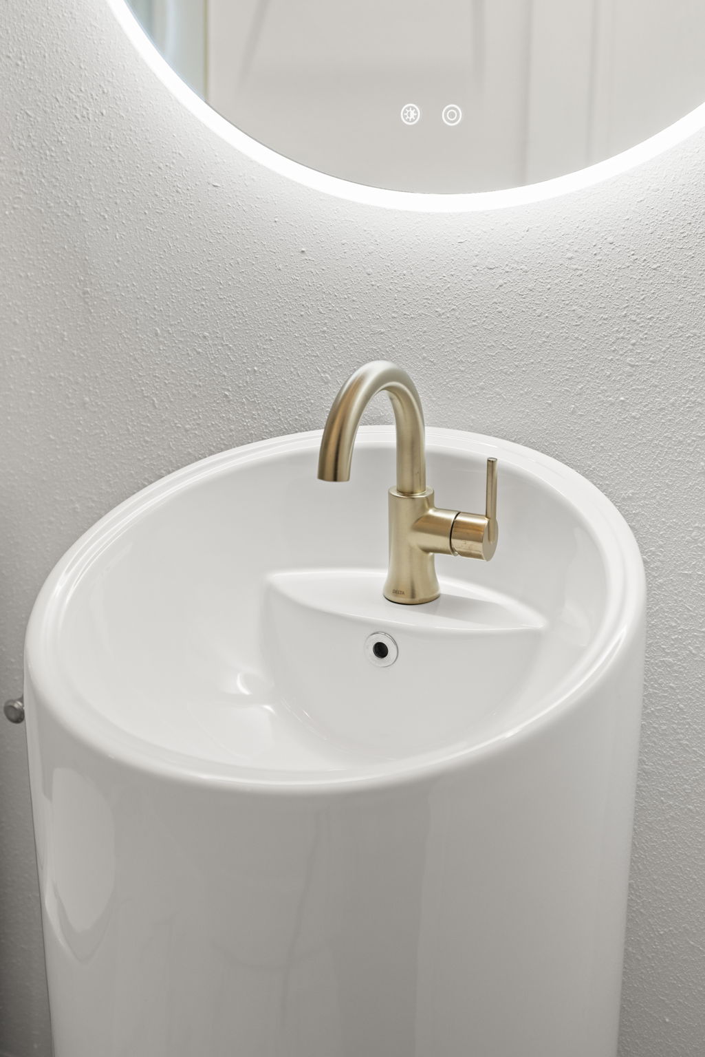 Modern bathroom sink with brass faucet