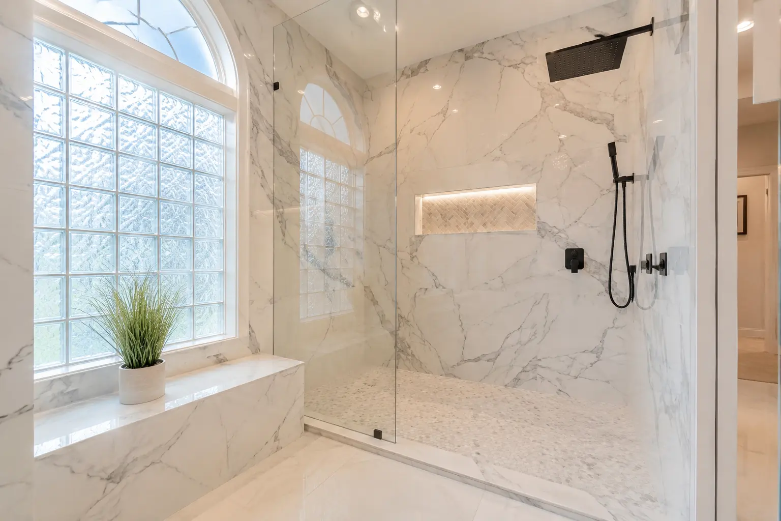 Full custom primary bathroom in Tampa Palms with frameless walk-in shower, soaking tub, double vanity, and heated floors by CMK Construction