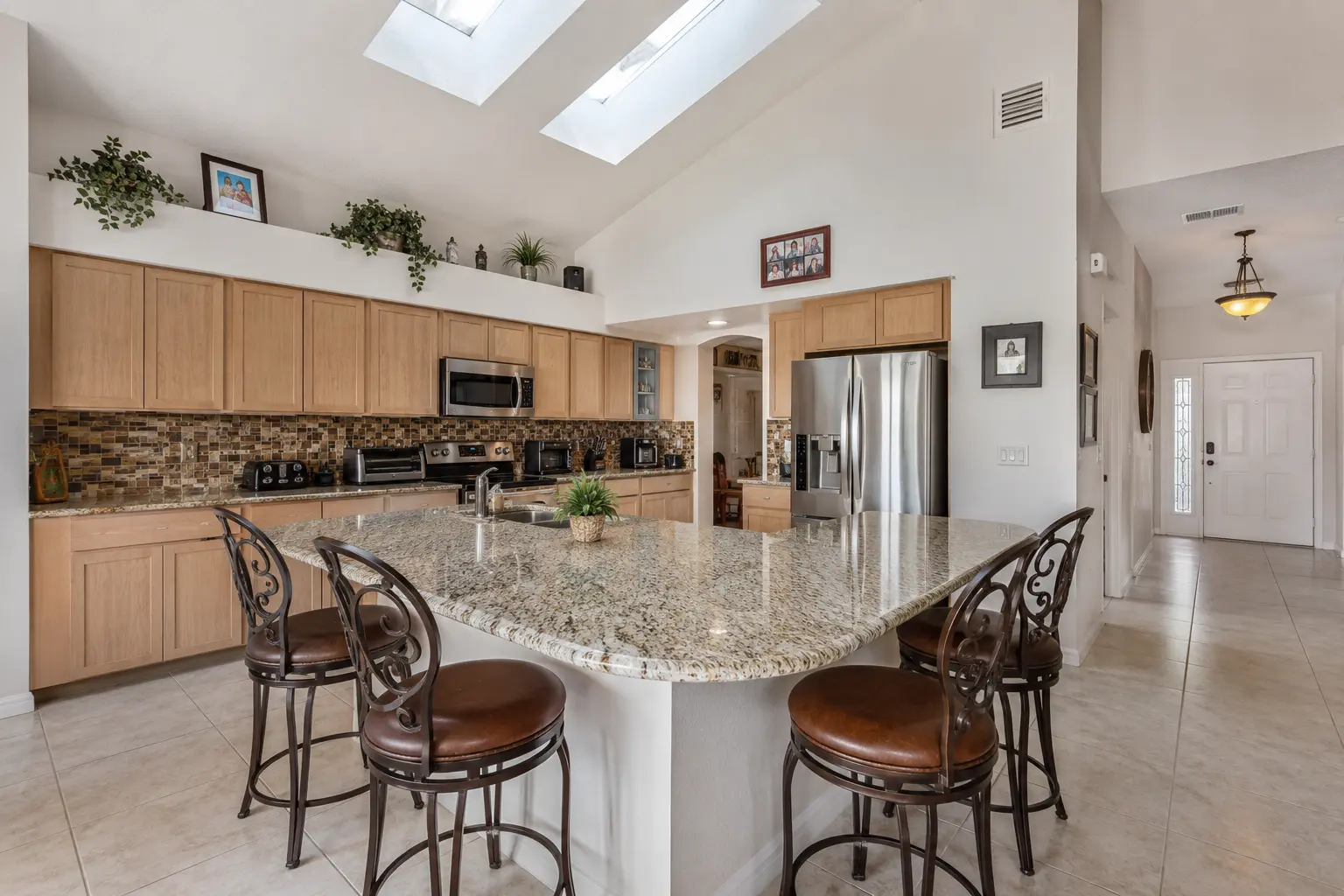 Dated Carrollwood kitchen with laminate counters and builder-grade oak cabinets before CMK Construction remodel