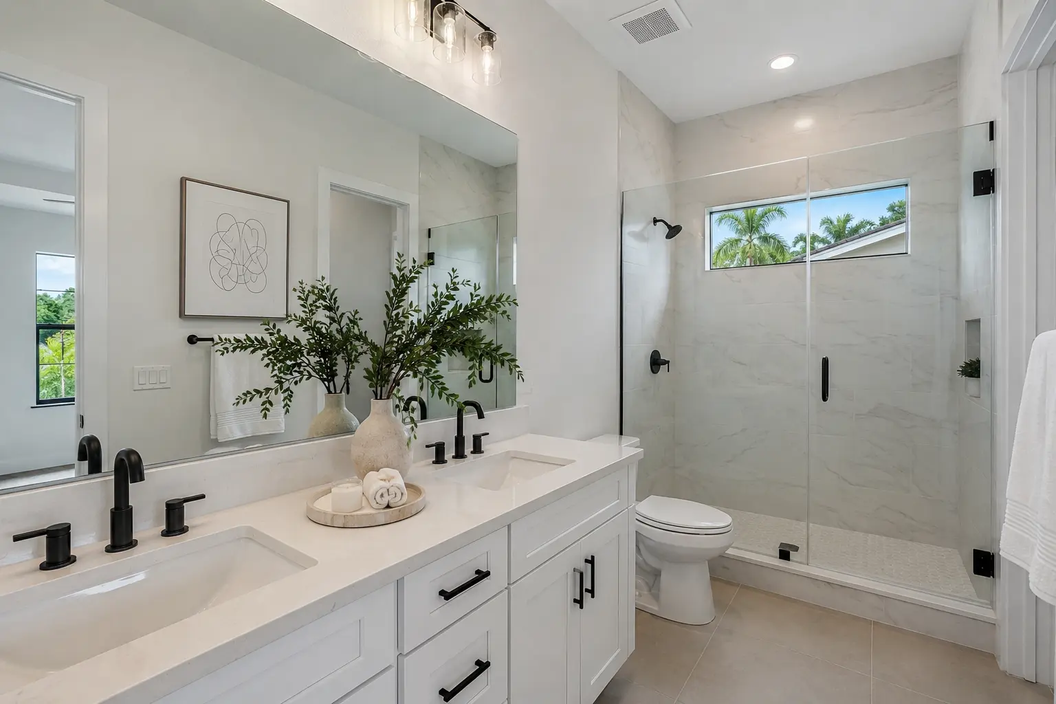 Guest bathroom remodel with white vanity, marble-look tile shower, and matte black fixtures in a St. Petersburg home